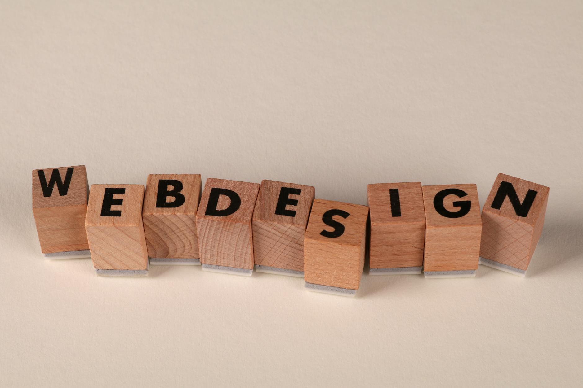 Wooden letter blocks spelling web design — the Website Build Kit cover image